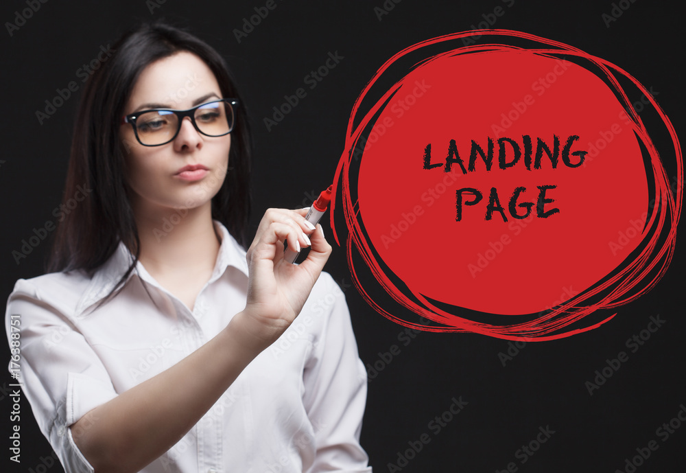 The concept of marketing, technology, the Internet and the network. A young businessman shows what is important for business: Landing page The concept of marketing, technology, the Internet and the network. A young businessman shows what is important for business: Landing page