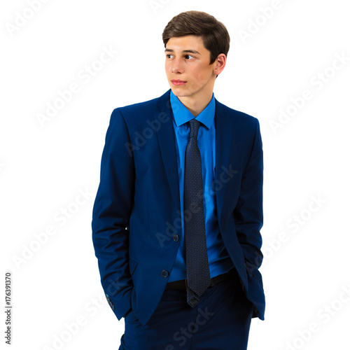 Portrait of a handsome serious teenager in a suit on a white background