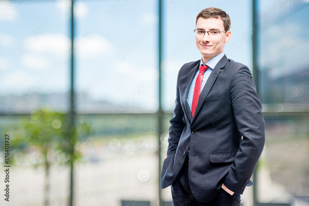 Successful businessman posing in office Successful businessman posing in office
