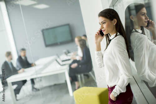 Modern business woman using...