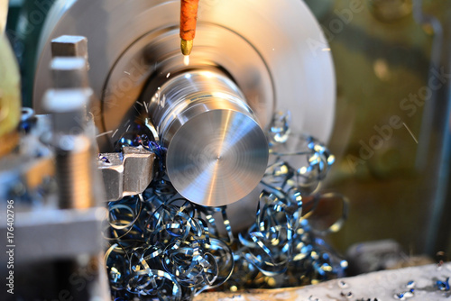 Professional machinist. Horizontal shot of a man operating lathe grinding machine metalworking industry concept copyspace