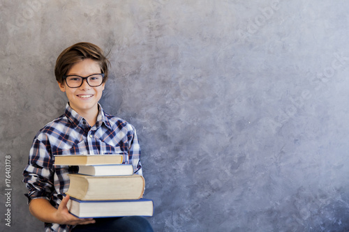 Cute teenage school boy hol...