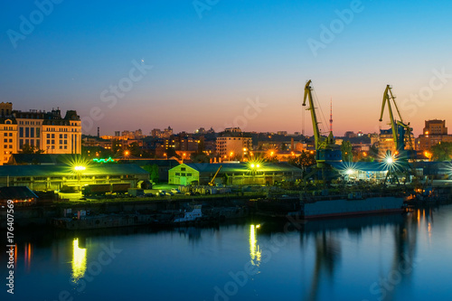Industrial river port with reflection in the water
