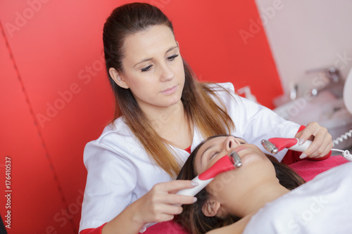 young woman receiving laser treatment