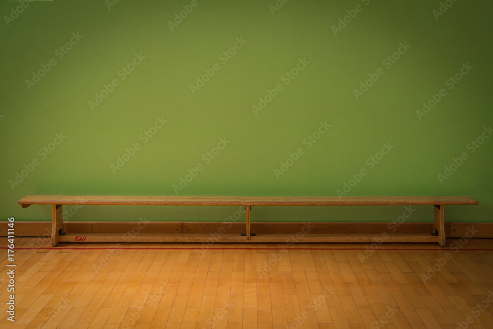 Obraz premium Wooden bench on indoor sport arena