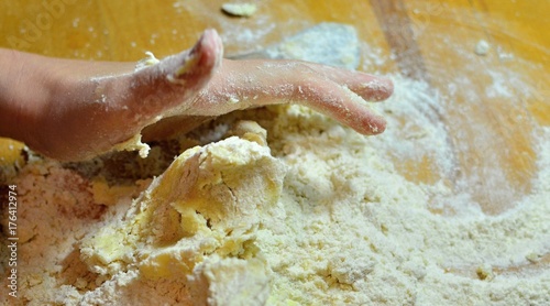 Kneading dough with hands on apple pie