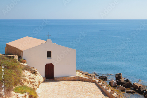 Church on sea coast. Porto-Torres, Italy
