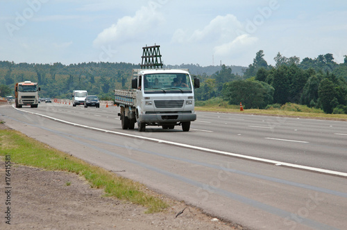 medium size glass carrying truck and other vehicles