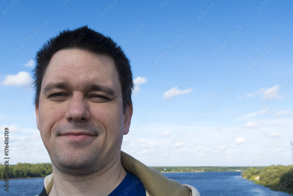 happy man on the background of the river