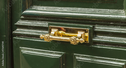 very nice brass door handle on a residential building