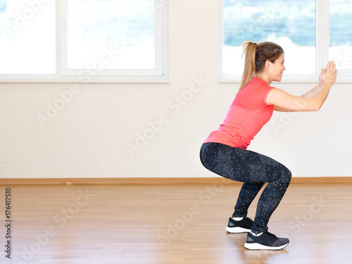 Active young woman exercising