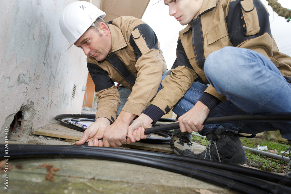 home renovation plumber fixing sewerage pipe at construction site home renovation plumber fixing sewerage pipe at construction site