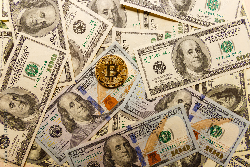 Golden bitcoin on us dollar bills electronic money exchange concept Golden bitcoin on us dollar bills electronic money exchange concept