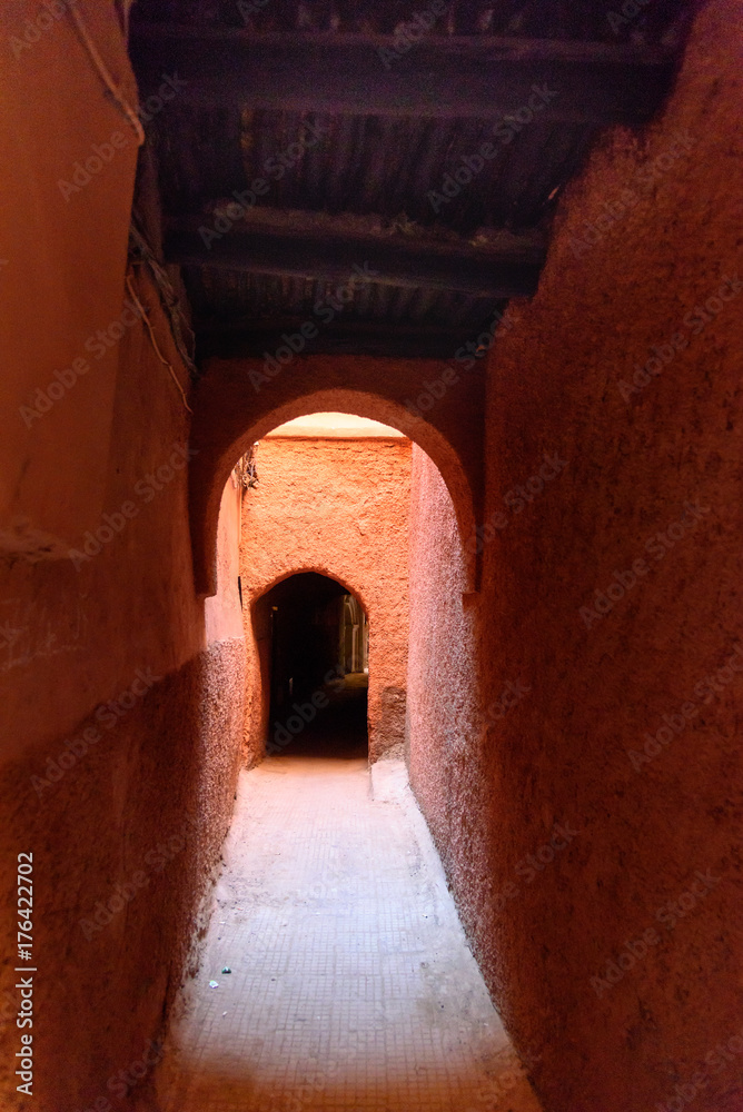Narrow passage between houses in medina. Marrakech. Morocco