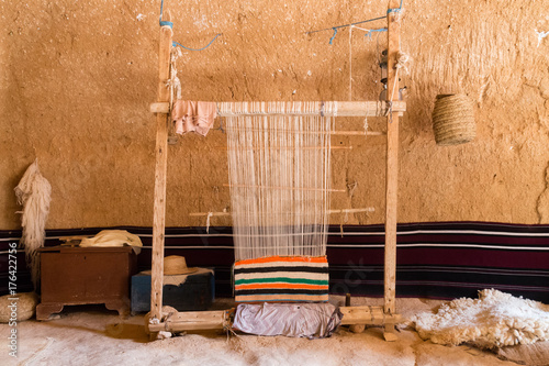 Hand loom in a berber cave house photo