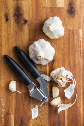 Fresh garlic and garlic presser.