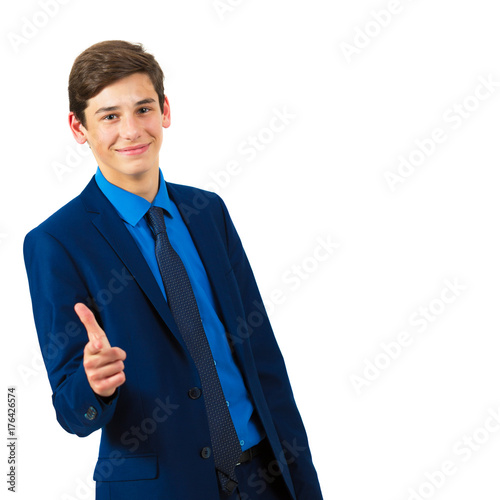 Portrait of a handsome cheerful teenager in a suit on a white background