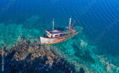 An old shipwreck abandoned stand on beach near village Rose in Montenegro 