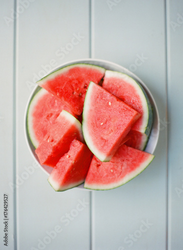 Fresh seedless watermelong on simple background
