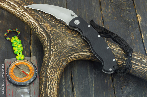 Kerambit for military task. Knife and compass. photo