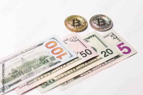 One hundred and seventy five dollars a usa and two coins of crypto currency on a white background.