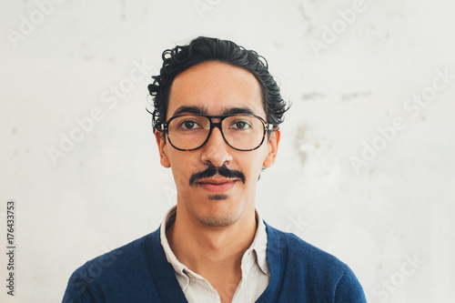 Headshot of Young Handsome Mexican Man With Glasses photo