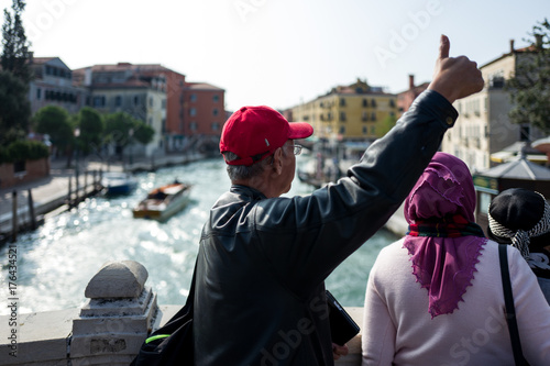 Tourist in Venice posing for camera photo