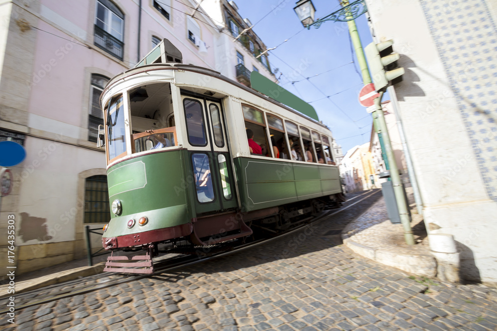 speeding historic tram lisbon portugal