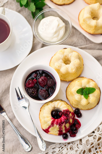 Baked sweet ricotta pudding cheesecake with sour cream and berries photo