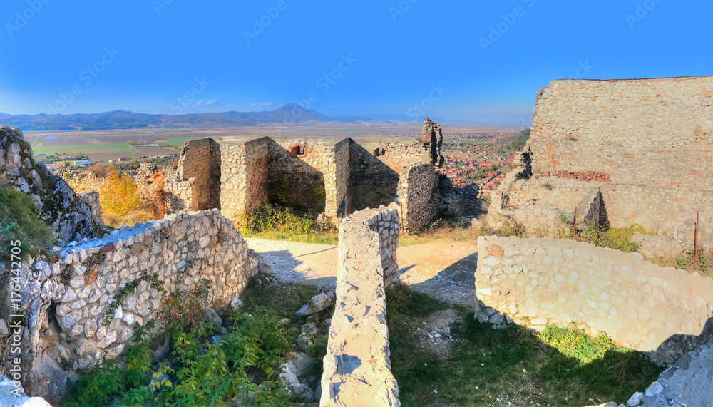 Antique ruins of the old medieval citadel in Rasnov, town of Transylvania, Romania
