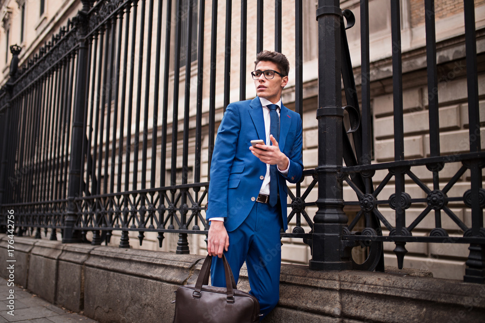 attractive businessman using a phone attractive businessman using a phone