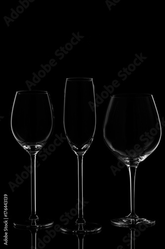 Glassware selection with wine, champagne and liquour glasses on the dark background