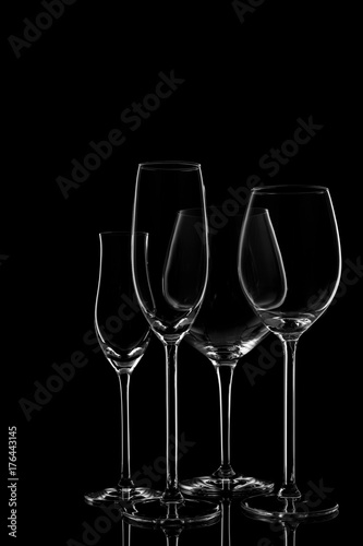 Glassware selection with wine, champagne and liquour glasses on the dark background