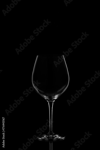 Red wine glass on the dark background