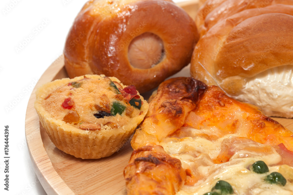 variety of bakery on wooden plate variety of bakery on wooden plate