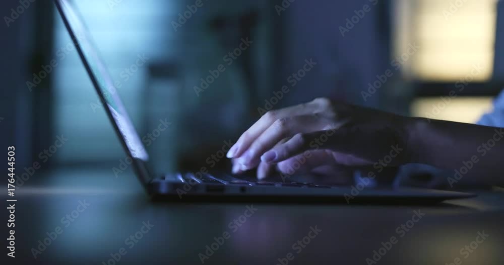 Working on laptop computer at home