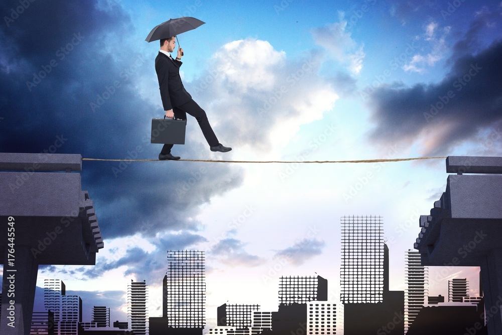 Composite image of businessman holding briefcase under umbrella Composite image of businessman holding briefcase under umbrella