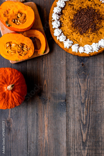 Pumpkin pie for thanksgiving day on dark wooden background top view copyspace