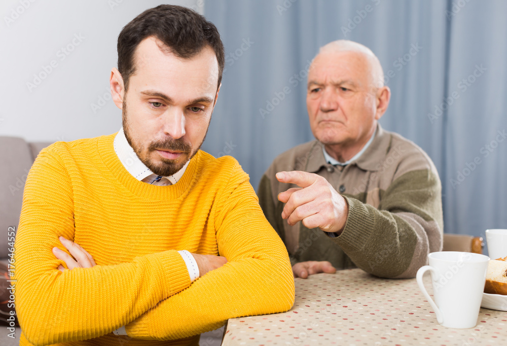 Fototapeta premium Aged father teaches his son
