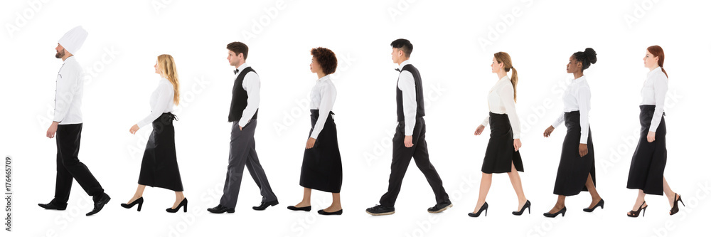 Young Restaurant Staff Walking In Row Young Restaurant Staff Walking In Row