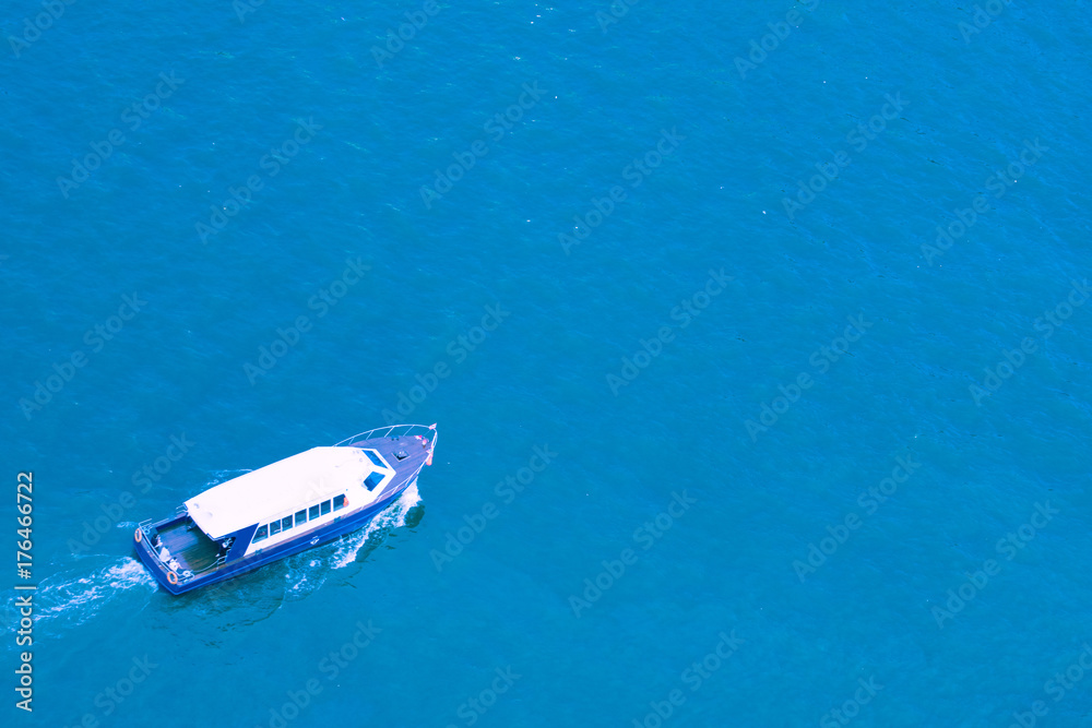 Fototapeta premium Aerial view of sailing boat at sea.