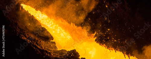 Tapping the Blast Furnace - liquid iron puring out of the taphole of a blast furnace