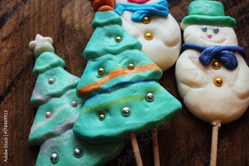 Candy christmas tree shape and snow man. Top view with