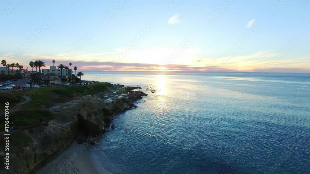 View of beach and ocean at sunset View of beach and ocean at sunset