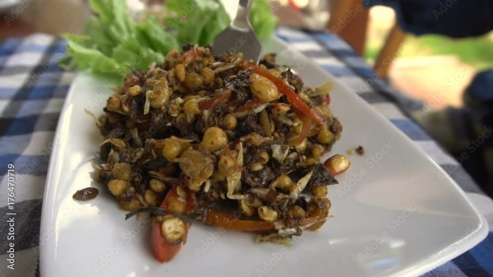 Eating Tea Leaves Salad. Slow Motion Eating Tea Leaves Salad. Slow Motion