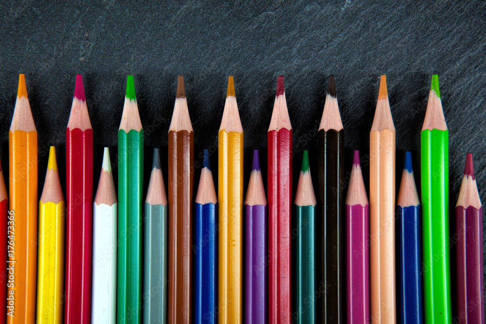 Colored pencils on a black stone slate Colored pencils on a black stone slate