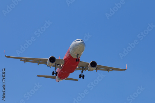 Passenger Airplane Taking Off Into The Blue Sky