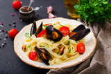 Seafood fettuccine pasta with mussels. Mediterranean delicacy food.