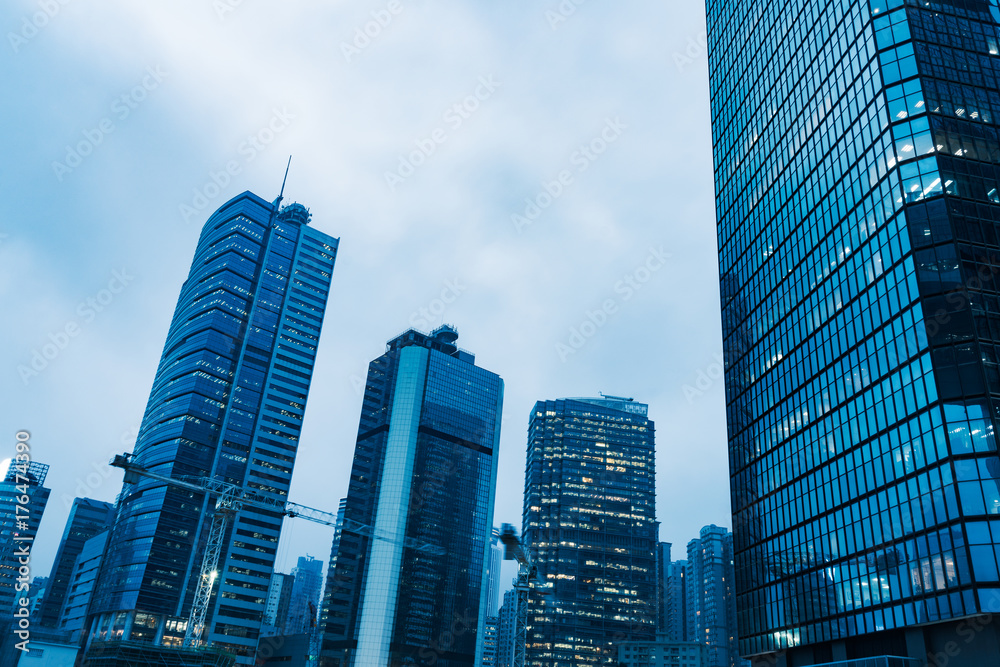directly below of modern financial skyscrapers in central Hong Kong,blue toned,china. directly below of modern financial skyscrapers in central Hong Kong,blue toned,china.