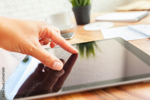 woman is working on tablet